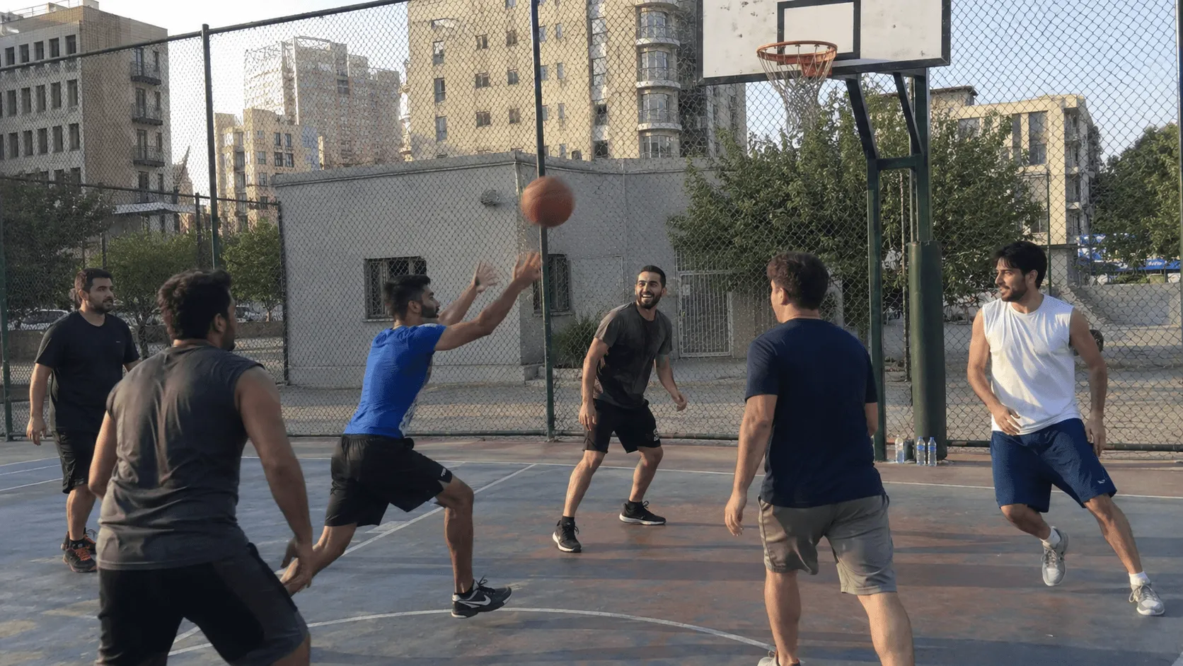 People playing a casual pickup basketball match